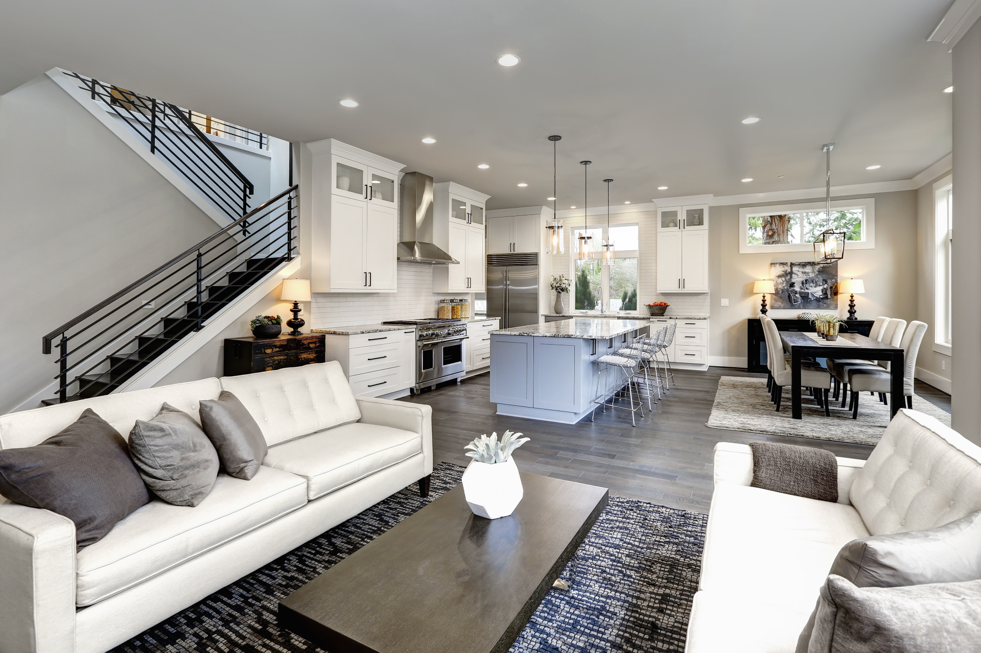 Renovated kitchen with white cabinetry and brass hardware